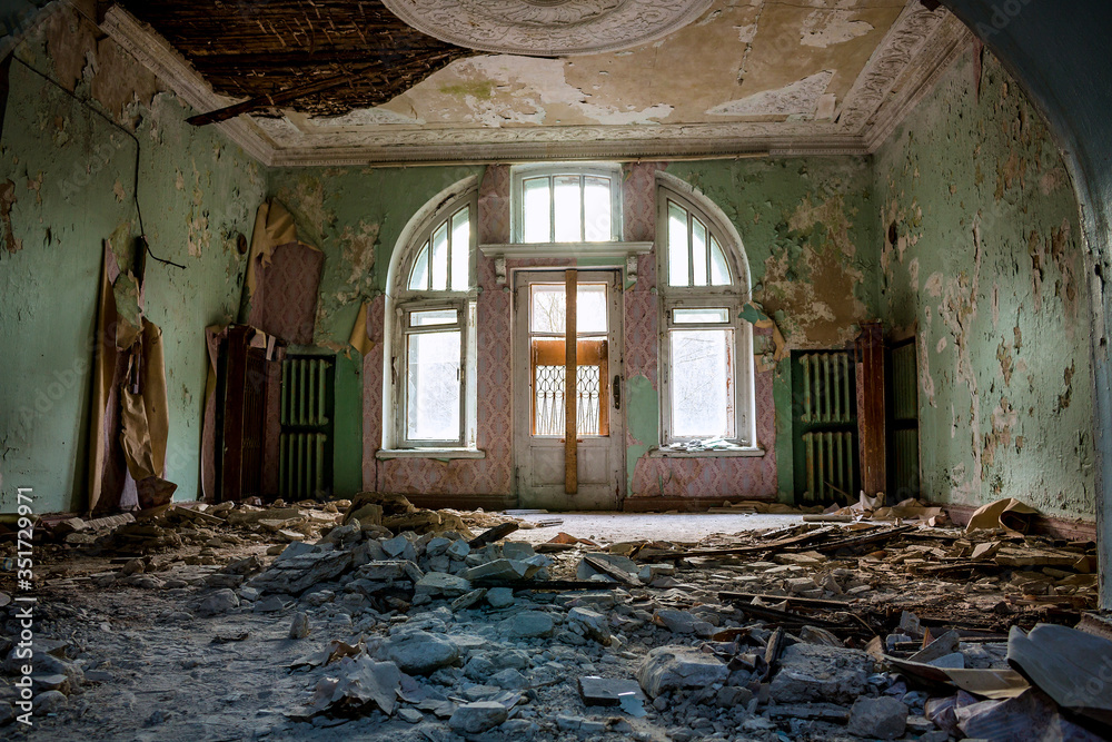 Collapsed stucco from the ceiling in the room of an old abandoned manor Collapsed stucco from the ceiling in the room of an old abandoned manor