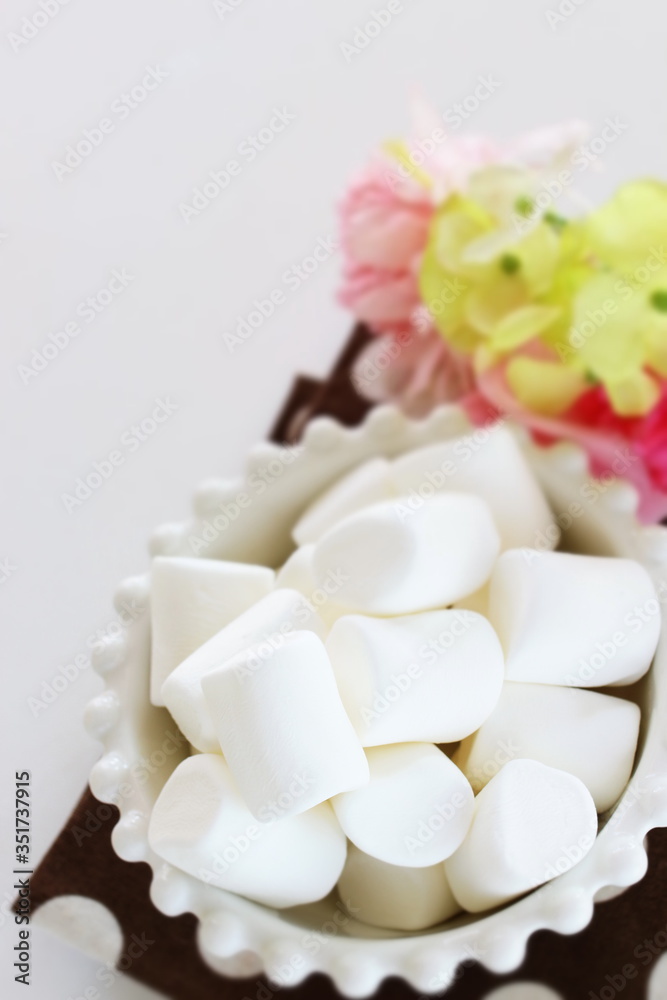 Marshmallow In bowl on white background with copy space Marshmallow In bowl on white background with copy space