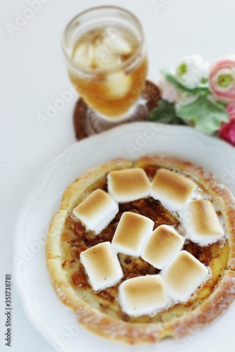 Marshmallow and sugar pizza on dish for sweet food