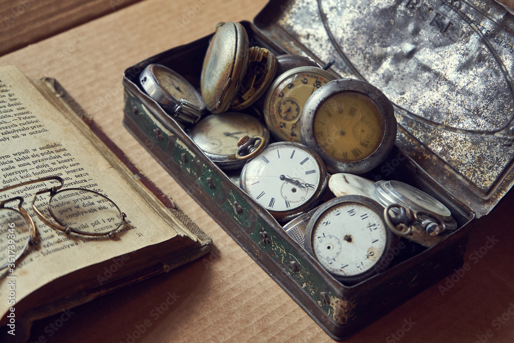 old pocket watch and book old pocket watch and book