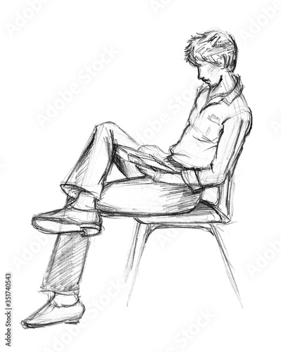 A rough sketch of a guy sitting on a chair and reading a book. Lead pencil on paper. Isolated image on a white background. © Tanya