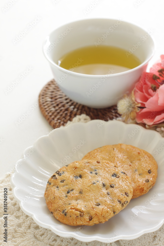 Japanese food, black sesame rice cracker on dish Japanese food, black sesame rice cracker on dish