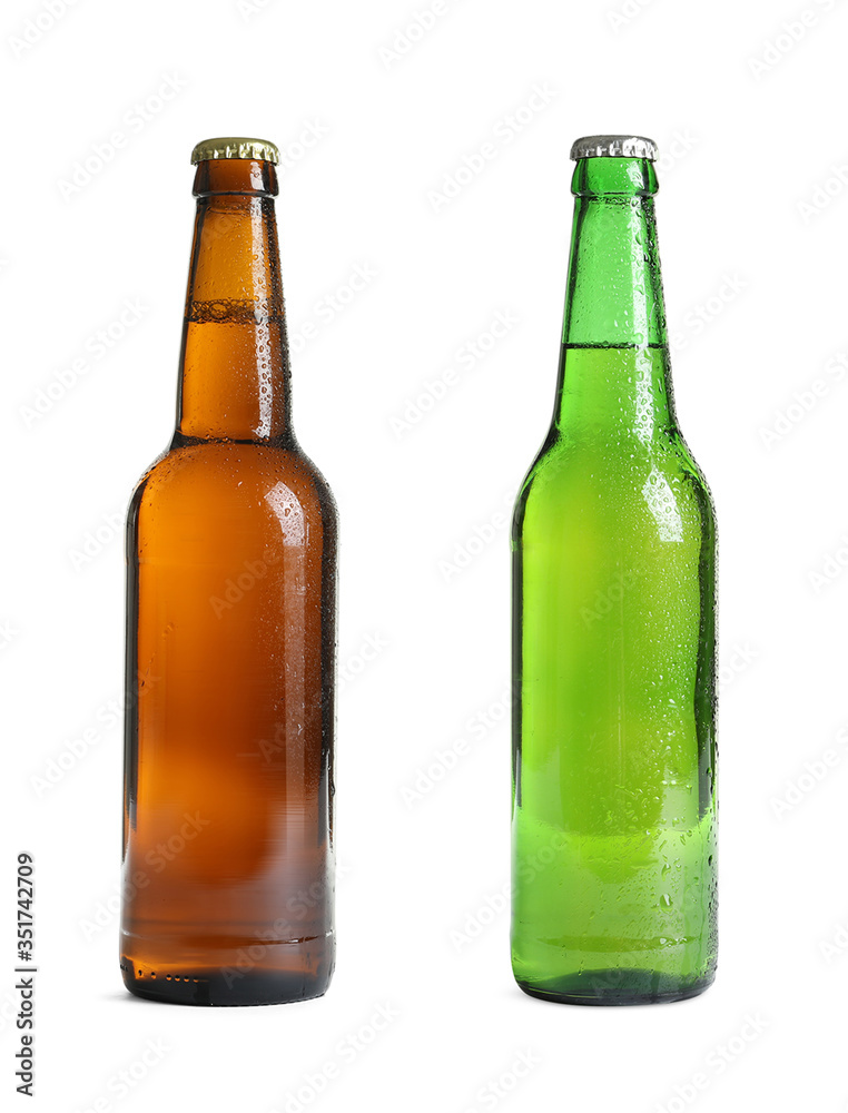 Different bottles of beer on white background