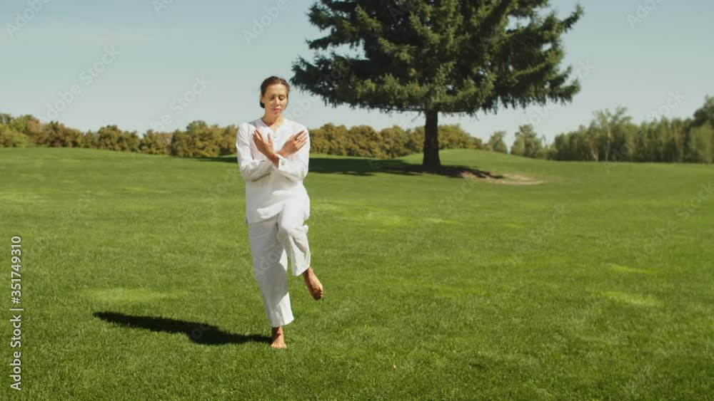 Yoga master doing yoga session at park. Calmness, mindfulness, meditation, harmony. Yoga master doing yoga session at park. Calmness, mindfulness, meditation, harmony.