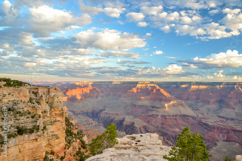 Grand Canyon National Park - South Rim - Cloudy blue sky in a sunny day, warn and cold tones.