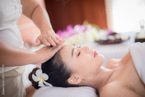 Body care. Spa body massage Asian woman hands treatment. Woman having massage in the spa salon