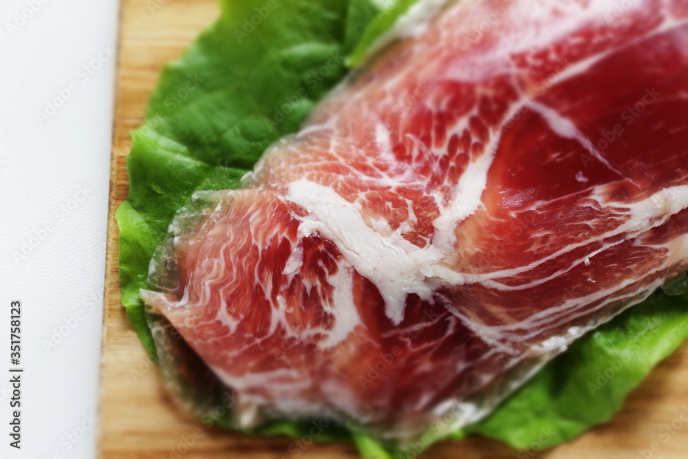 sliced ham on plate with copy space for gourmet sliced ham on plate with copy space for gourmet