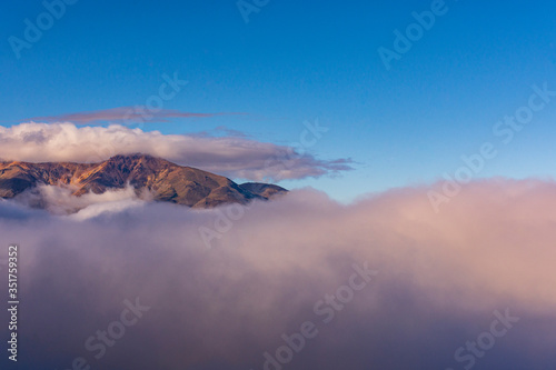 Scene view of Andes mountain landscape with low clouds in Esquel, Patagonia, Argentina