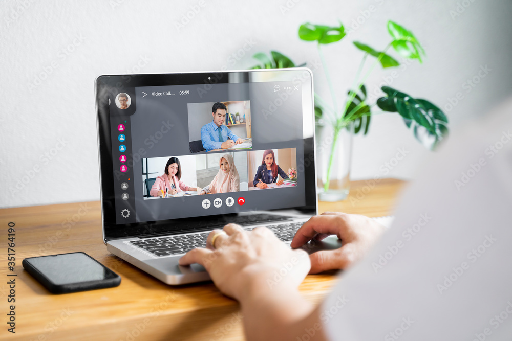 Fototapeta premium businessman colleagues in remote video call conference discussing plans and company future strategies, working at home office during quarantine isolation distancing of coronavirus COVID-19 pandemic