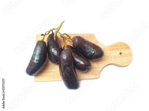 Moon Drops grape or Witch Fingers and cut board grape on white background 