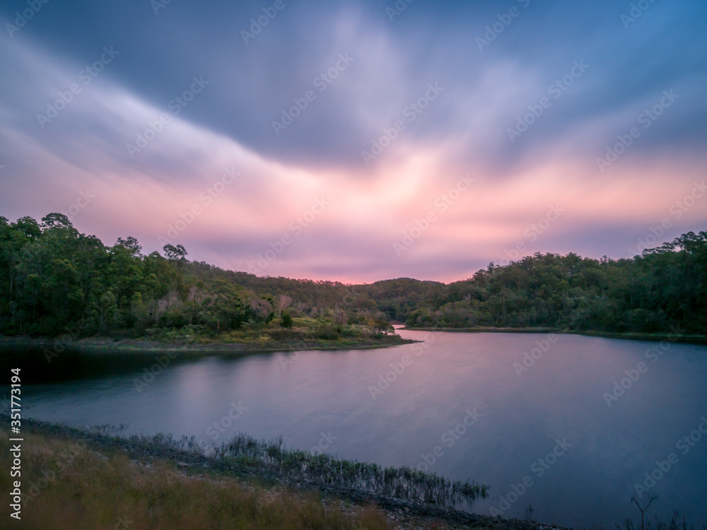 Naklejka premium Beautiful Lakeside Sunset with Pastel Colours and Reflections