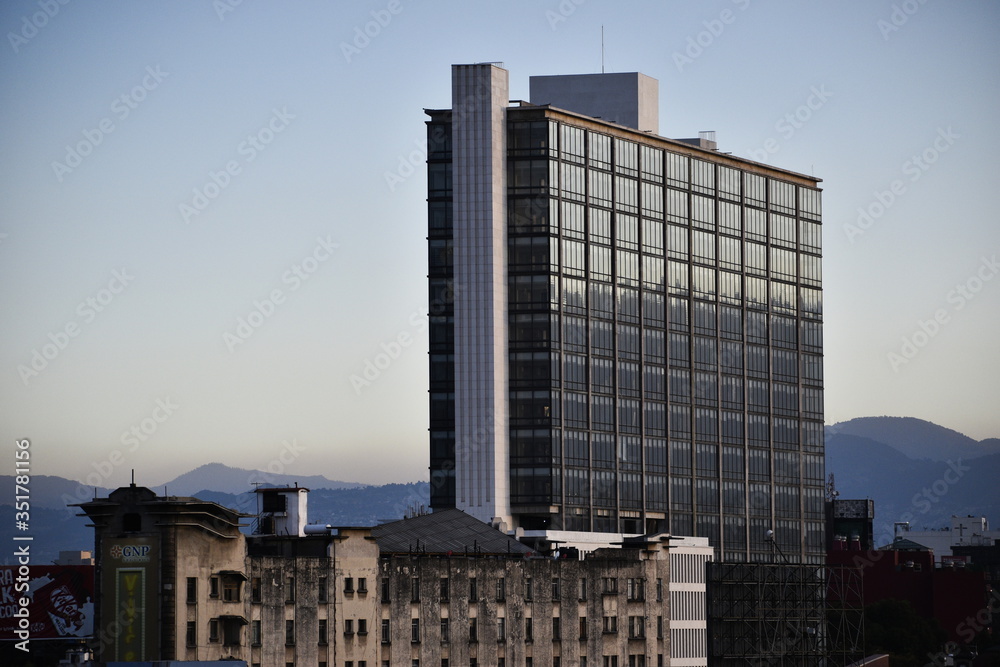 building in the city at sunset building in the city at sunset