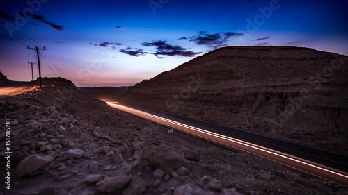 highway long exposure vehicle light trails curvy highway between mountains i sunset 
eilat israel. photo