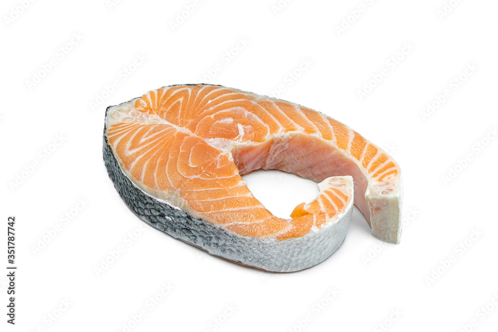 Fresh salmon fillets, seafood, cut into slices on a thin white background Fresh salmon fillets, seafood, cut into slices on a thin white background
