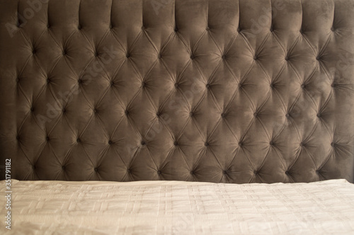 Fabric headboard provides a smooth gradient. photo