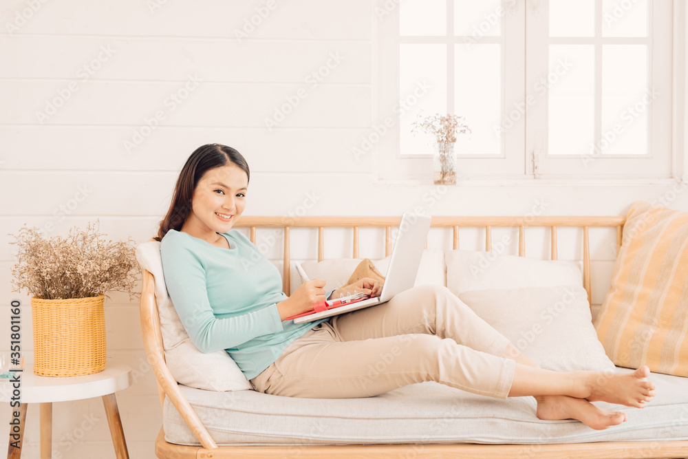 Woman freelancer female hands with pen writing on notebook at home or office Woman freelancer female hands with pen writing on notebook at home or office