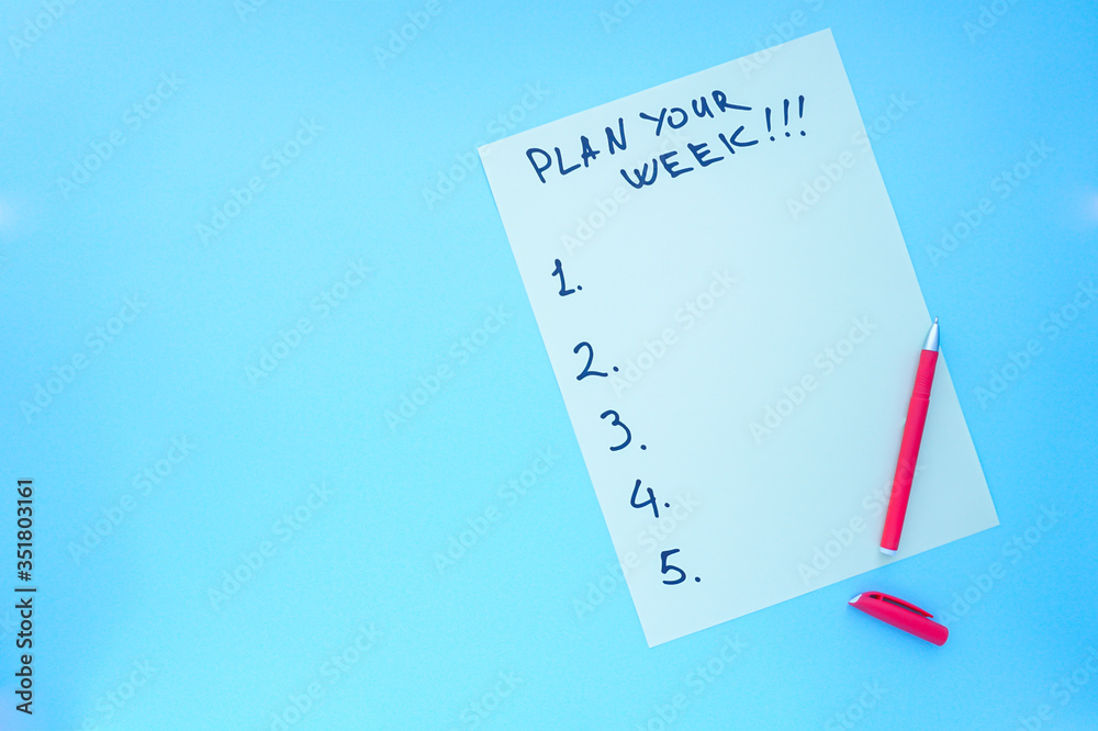 plan your week .a pen and a sheet of paper with a list photo plan your week .a pen and a sheet of paper with a list photo