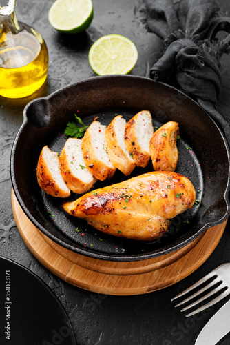Grilled chicken breast. Sliced chicken fillet with lime. 