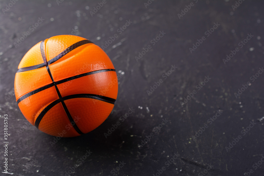 basketball on a dark textured background, free space