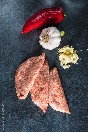 Raw kebab meat on black background. Free space. Top view.