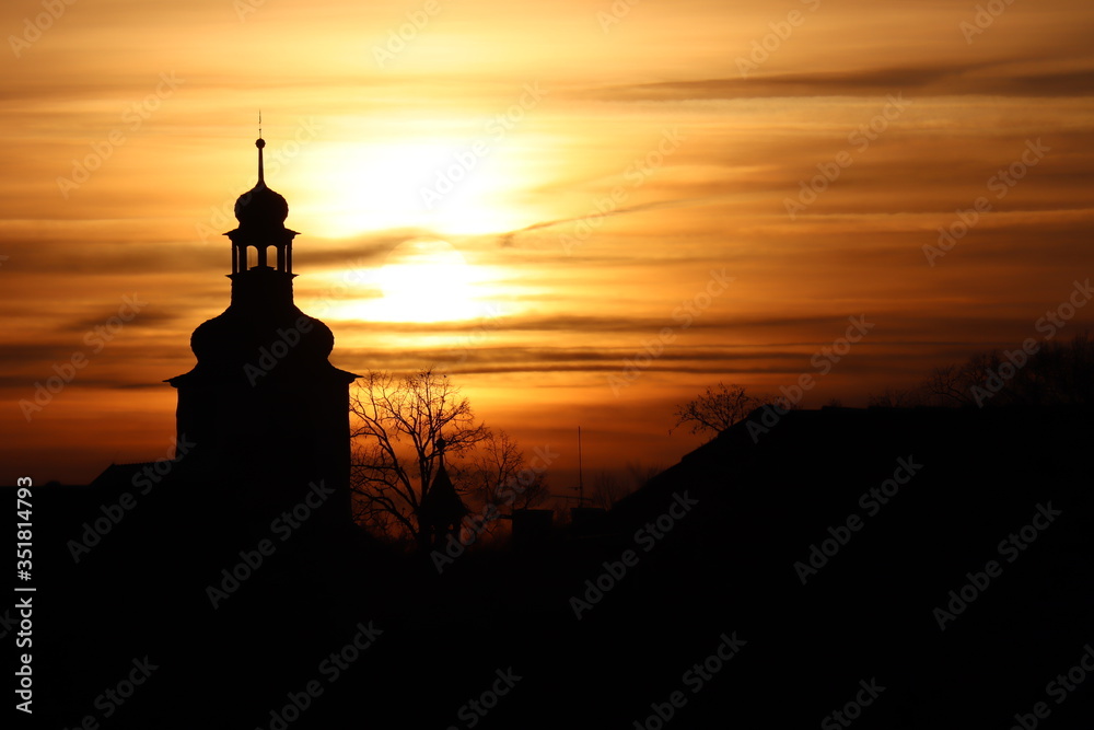 silhouette of a church in sunset