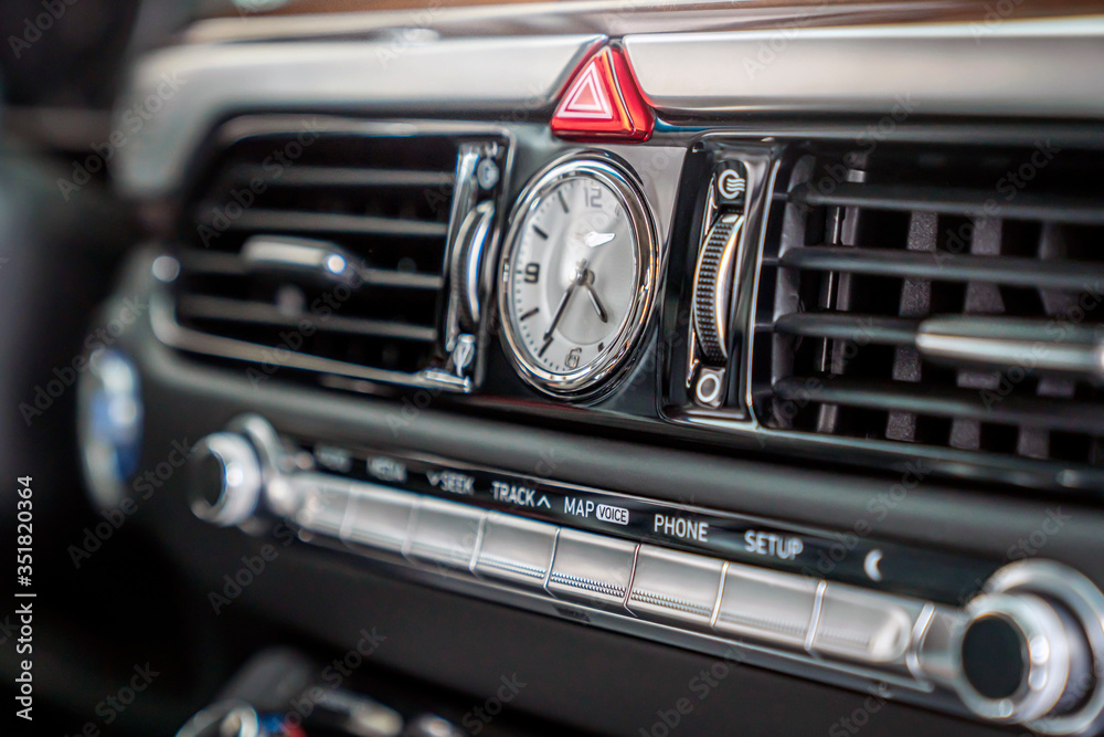 analog clock in the car interior