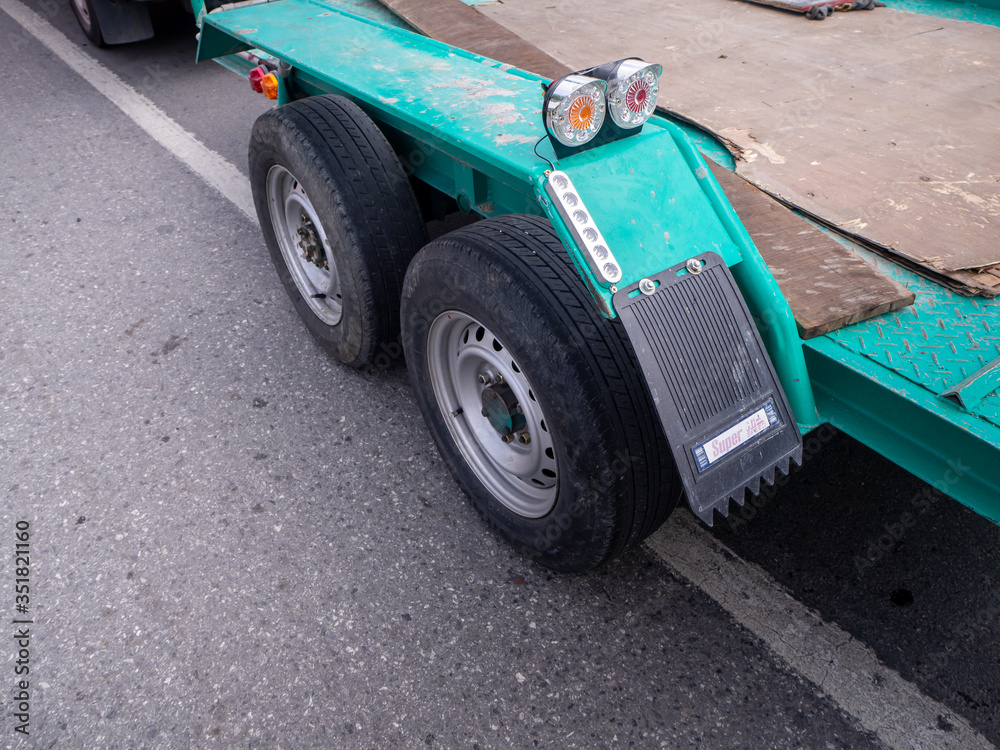 transporting small cargo trailer for a car strapped transporting small cargo trailer for a car strapped