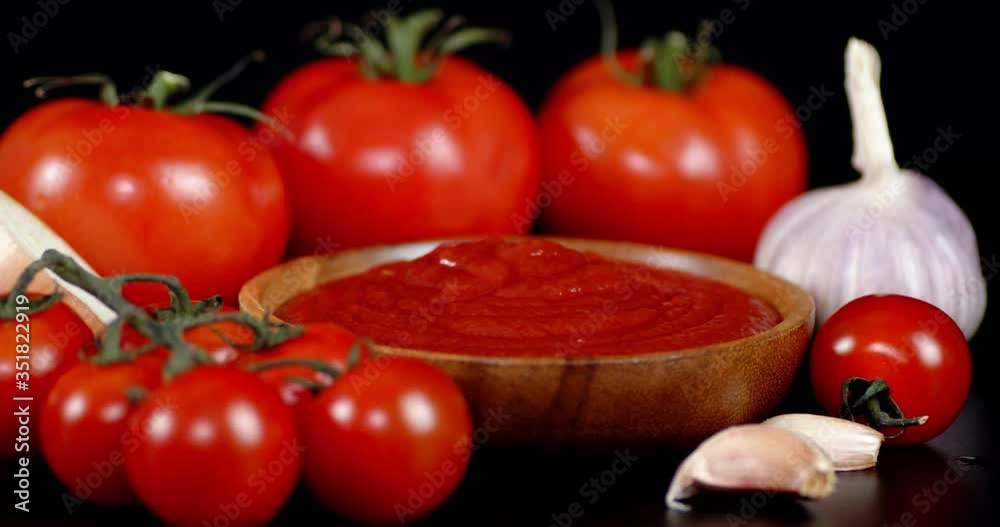 Tomato sauce with spices slowly rotates. Tomato sauce with spices slowly rotates.