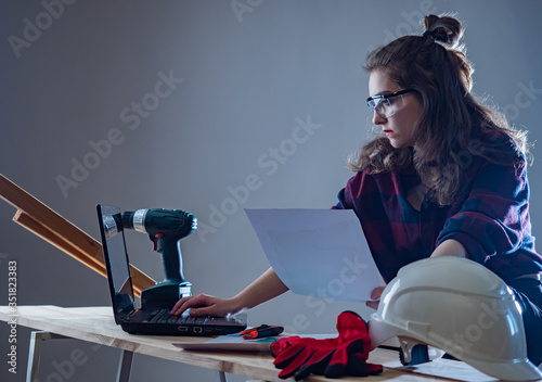 The girl-a carpenter. A wom...