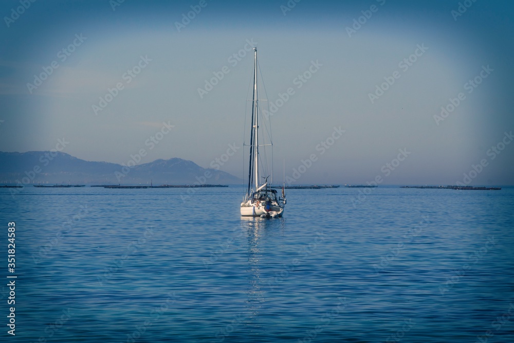sailboat sailing in the calm waters of the sea