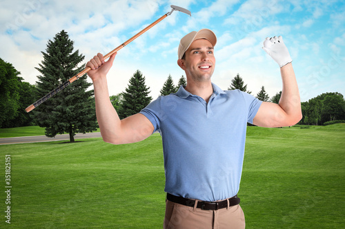 Young man with golf club on green course