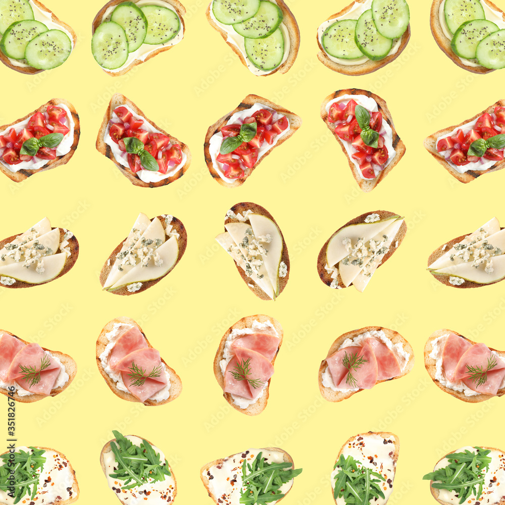 Set of delicious toasted bread with different toppings on yellow background, top view Set of delicious toasted bread with different toppings on yellow background, top view