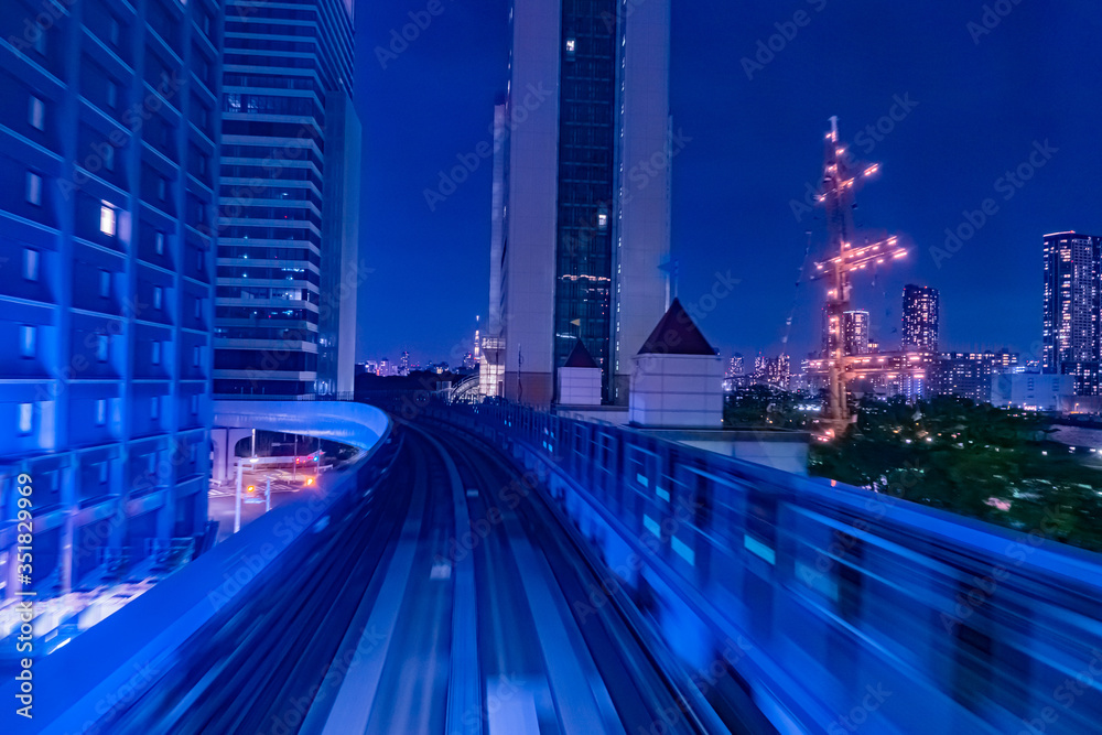 Fototapeta premium Japan. Railway tracks in Tokyo. Urban landscape in blue. Transport system of Japan. Railway in the business center of Tokyo. Evening in the Japanese capital. Travel to East Asia.