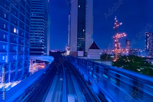 Japan. Railway tracks in Tokyo. Urban landscape in blue. Transport system of Japan. Railway in the business center of Tokyo. Evening in the Japanese capital. Travel to East Asia.