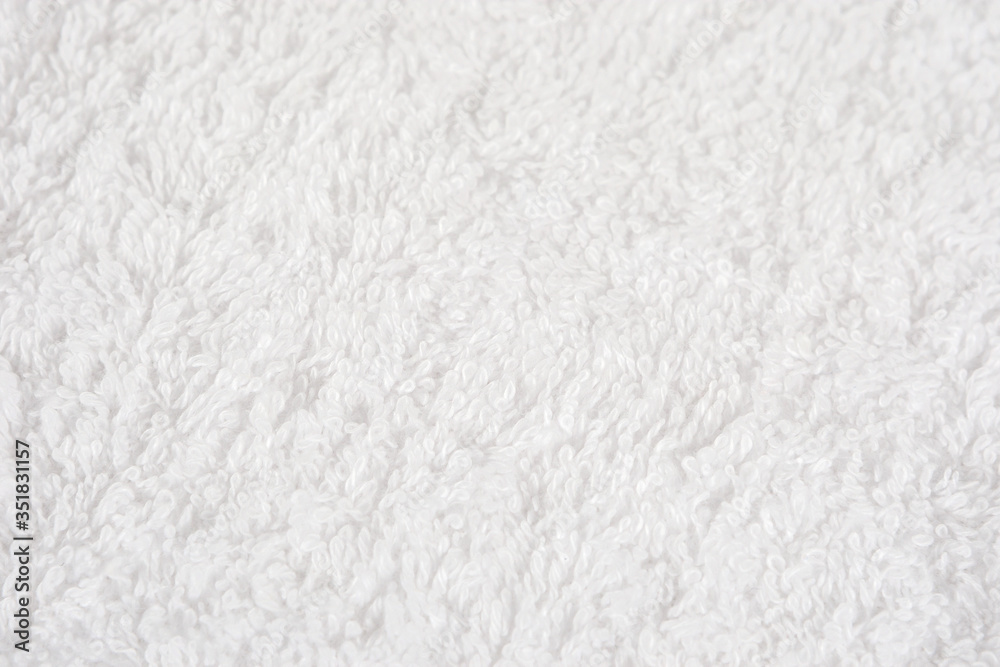 Light fluffy background. White Terry background of thread. Terry cloth close-up. The concept of purity and softness. Light fluffy background. White Terry background of thread. Terry cloth close-up. The concept of purity and softness.