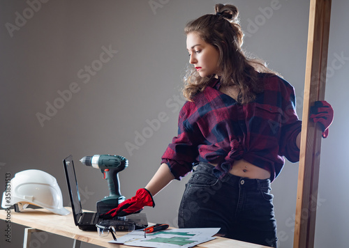 A female carpenter. The gir...