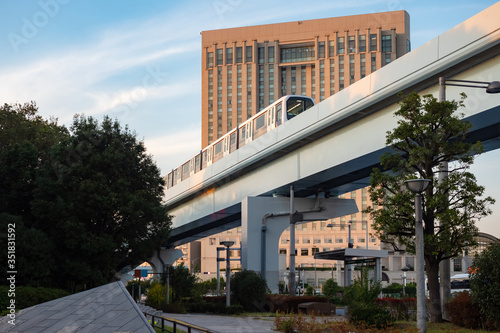 Japan. A train rides on a r...