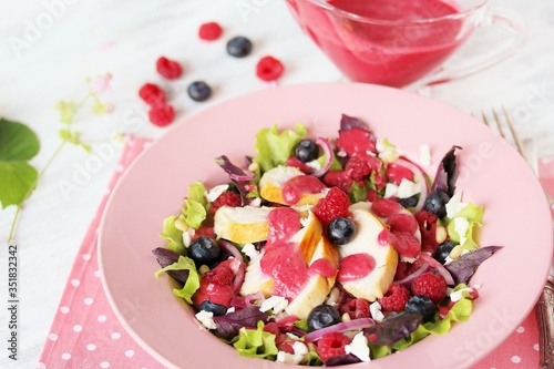 Salad with berries and chicken breast, seasoned with berry vinaigrette. Berry Vinaigrette Dressing