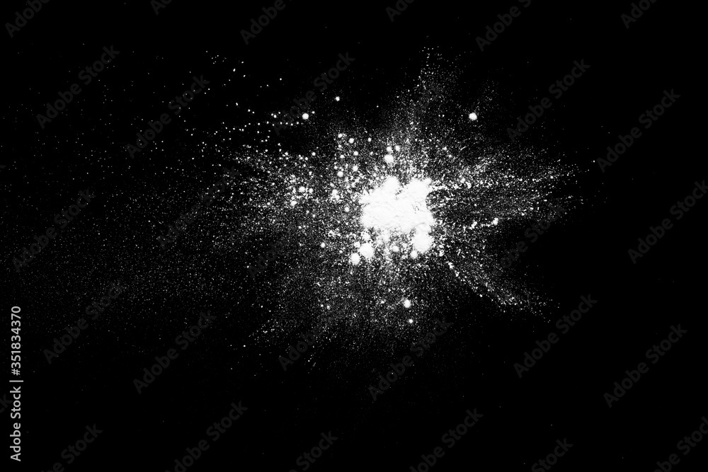 White powder isolated on the black background. White powder isolated on the black background.