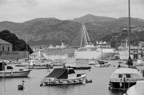 Famous landmark Franjo Tudman Bridge in port of Dubrovnik, Croatia with harbor and panoramic scenic landscape of city and scenery in summer from cruiseship or cruise ship liner photo