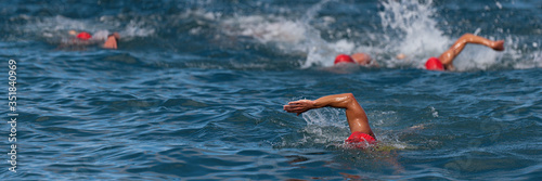 Group of swimmers swim in the sea at the races, open water sport © pavel1964