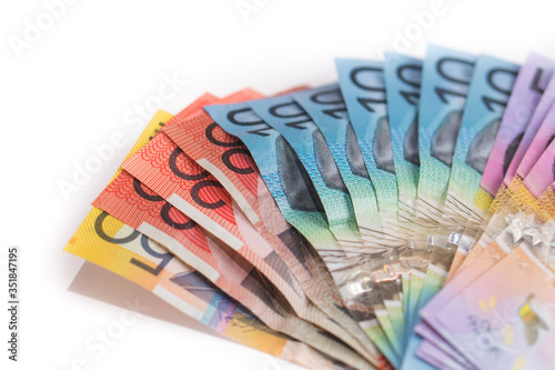 handful of Australian money with 20 dollar bills in focus