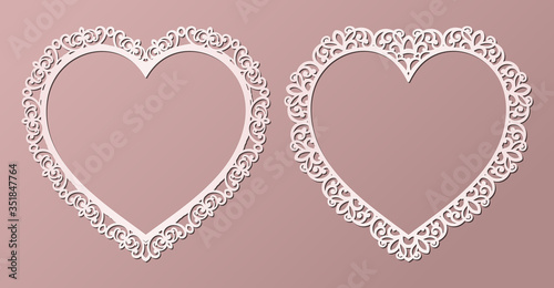 Laser cut paper lace frames in the shape of heart, vector illustration. Ornamental cutout photo frame with pattern. Element for wedding invitation and Valentine greeting card.