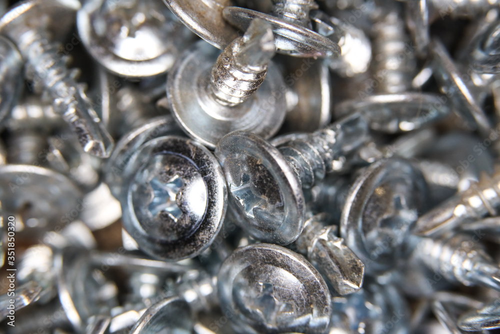 Fototapeta premium many macro stainless self tapping screws texture