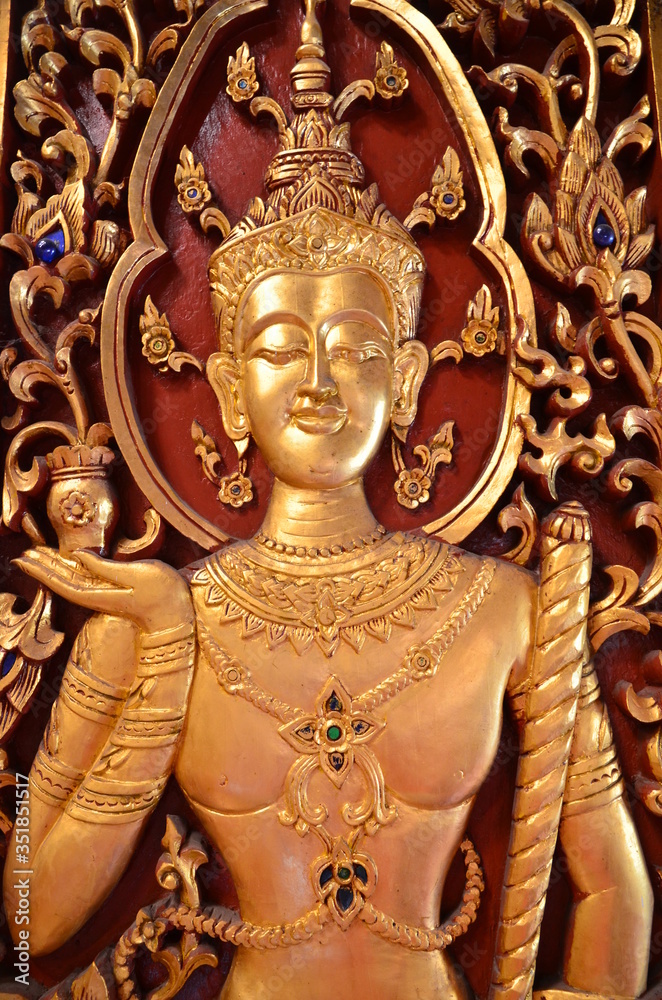 Incredible beauty at Wat Phra Singh in Chiang Rai: Image of a golden Buddha on a shutter