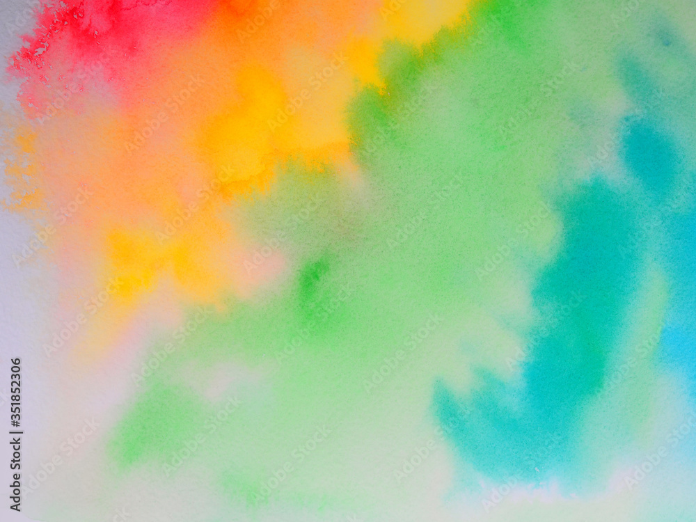 watercolor paint of different colors spread on white paper