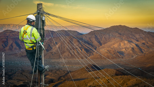 Engineer Repairing A Desert Telephone Line photo