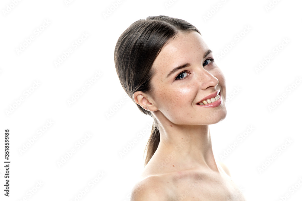 A close-up portrait of a girl with freckles and clear skin. Light blue eyes. The girl has different emotions, she looks at the camera. Isolated on a white background A close-up portrait of a girl with freckles and clear skin. Light blue eyes. The girl has different emotions, she looks at the camera. Isolated on a white background