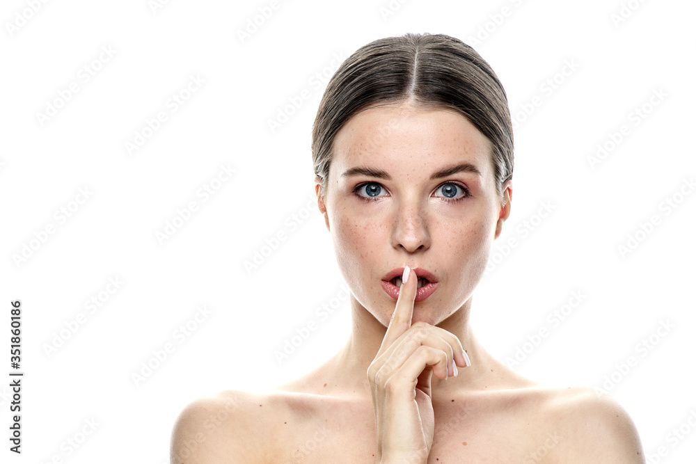 A close-up portrait of a girl with freckles and clear skin. Light blue eyes. The girl has different emotions, she looks at the camera. Isolated on a white background A close-up portrait of a girl with freckles and clear skin. Light blue eyes. The girl has different emotions, she looks at the camera. Isolated on a white background