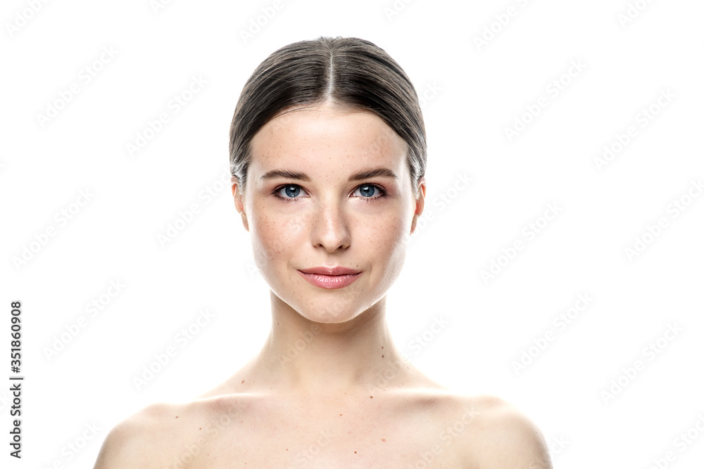 A close-up portrait of a girl with freckles and clear skin. Light blue eyes. The girl has different emotions, she looks at the camera. Isolated on a white background A close-up portrait of a girl with freckles and clear skin. Light blue eyes. The girl has different emotions, she looks at the camera. Isolated on a white background